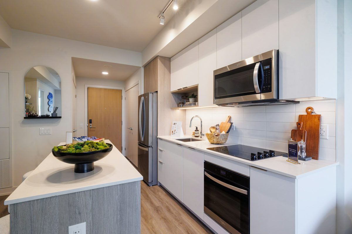 Over-the-range microwave above a cooktop in a modern kitchen
